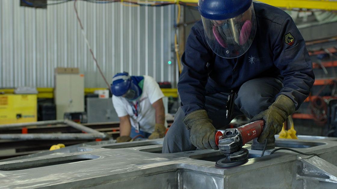 A man doing aluminum welding