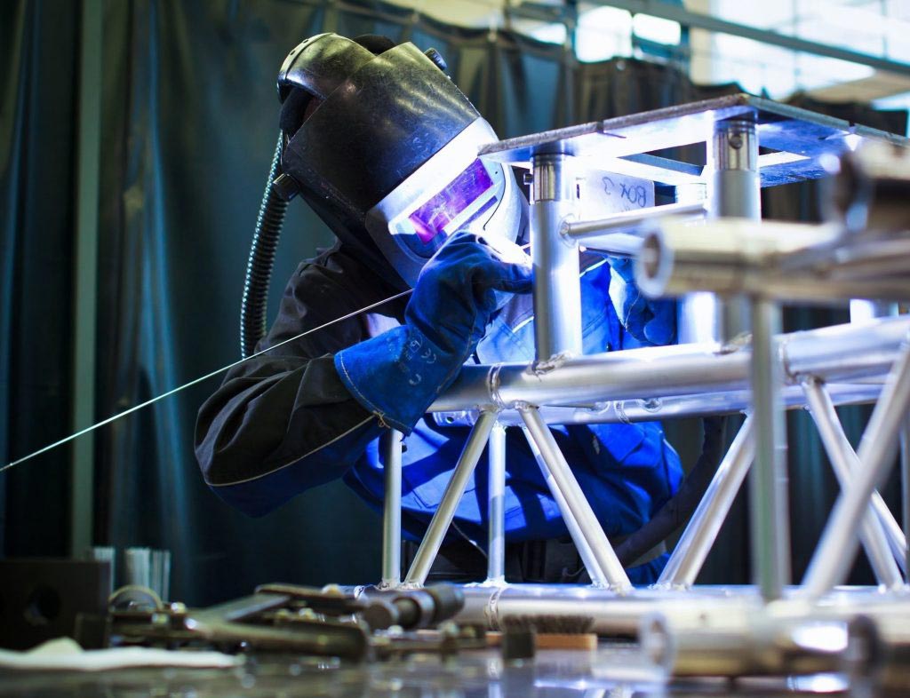 A welder TIG welding tubing